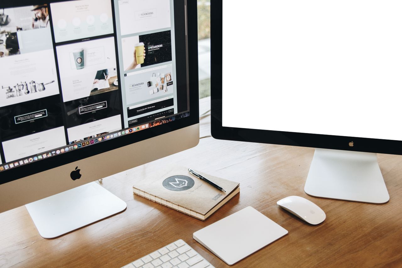 hero-img High-angle view of a stylish work desk featuring dual monitors, keyboard, mouse, and modern accessories.